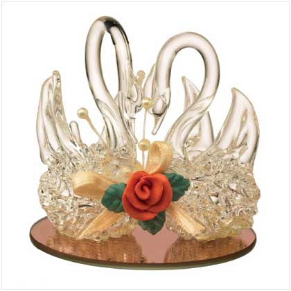 GLASS SWANS ON A REFLECTIVE POND